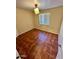 Well-lit bedroom featuring tile flooring and neutral walls at 3211 W Campbell Ave, Phoenix, AZ 85017