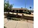 Charming single-story home with updated windows and a unique brick and stone wall at 3211 W Campbell Ave, Phoenix, AZ 85017