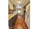 Spacious kitchen featuring tile floors, gray cabinets, and access to another room at 3211 W Campbell Ave, Phoenix, AZ 85017