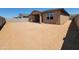 Large backyard with fresh landscaping and block wall at 37131 W Parador Ln, Maricopa, AZ 85138