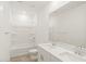 Bright bathroom with double sink vanity, tile floor, and tub-shower combo at 37131 W Parador Ln, Maricopa, AZ 85138