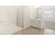 Bright bathroom with double sinks, tile flooring, and lots of natural light at 37131 W Parador Ln, Maricopa, AZ 85138