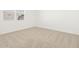 Bedroom features neutral carpet, large window, and lots of natural light at 37131 W Parador Ln, Maricopa, AZ 85138