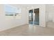 Bright dining room with a modern chandelier and sliding glass doors at 37131 W Parador Ln, Maricopa, AZ 85138