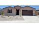 Charming single-story home with a well-maintained gravel front yard and a two-car garage at 37131 W Parador Ln, Maricopa, AZ 85138