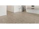 Open living area with tile flooring, perfect for easy cleaning and modern style at 37131 W Parador Ln, Maricopa, AZ 85138
