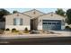 Charming single-story home with desert landscaping and a two-car garage, offering a welcoming curb appeal at 37194 W La Paz St, Maricopa, AZ 85138