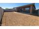 Large backyard featuring a covered patio and space ready for landscaping and outdoor enjoyment at 37400 W San Sisto Ave, Maricopa, AZ 85138