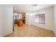 Open-concept dining area next to kitchen featuring recessed lights and tile floor at 5130 W Molly Ln, Phoenix, AZ 85083