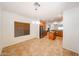 Bright dining area featuring tile flooring, modern chandelier, and stainless refrigerator at 5130 W Molly Ln, Phoenix, AZ 85083