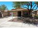 Inviting single-story home showcasing stone accents, desert landscaping, and a covered entryway at 5130 W Molly Ln, Phoenix, AZ 85083