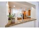 View of a kitchen featuring granite countertops, wood cabinets, and stainless appliances at 5130 W Molly Ln, Phoenix, AZ 85083