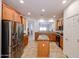 Bright kitchen with granite countertops, stainless appliances, and a central island at 5130 W Molly Ln, Phoenix, AZ 85083