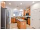 Well-lit kitchen with granite countertops, stainless appliances, and a kitchen island at 5130 W Molly Ln, Phoenix, AZ 85083
