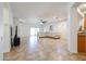 Open-concept living room featuring tile floors, a ceiling fan, recessed lighting, and a view of the kitchen at 5130 W Molly Ln, Phoenix, AZ 85083