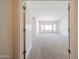 Living Room featuring neutral carpet and a large window to let in plenty of light at 5130 W Molly Ln, Phoenix, AZ 85083