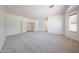 Expansive living room featuring neutral carpet, bright walls, and large closet at 5130 W Molly Ln, Phoenix, AZ 85083