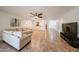 Well-lit living room showcasing tile flooring, a ceiling fan, and an open layout to the kitchen at 5130 W Molly Ln, Phoenix, AZ 85083
