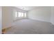 Large living room with neutral carpet and bay window for ample natural light at 5130 W Molly Ln, Phoenix, AZ 85083