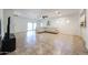 Bright and airy living room with tile flooring, a ceiling fan, and sliding glass doors to the backyard at 5130 W Molly Ln, Phoenix, AZ 85083