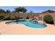 A sparkling pool with lush landscaping creates a backyard oasis at 5130 W Molly Ln, Phoenix, AZ 85083