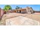 Large backyard with a covered patio, block fence, and mature palm tree, providing a private outdoor space at 5237 W Mountain View Rd, Glendale, AZ 85302