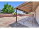 Covered patio overlooking a large backyard with desert landscaping, rock features, and privacy fencing at 5237 W Mountain View Rd, Glendale, AZ 85302