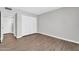 Bedroom featuring wood-look flooring, closet, and neutral wall colors at 5237 W Mountain View Rd, Glendale, AZ 85302