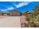 Charming home featuring a spacious driveway, two car garage and desert landscaping at 5237 W Mountain View Rd, Glendale, AZ 85302