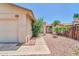 Charming single-story home featuring a low-maintenance rock front yard and walkway leading to the entrance at 5237 W Mountain View Rd, Glendale, AZ 85302