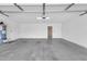 Garage featuring concrete flooring, water heater, and entry door at 5237 W Mountain View Rd, Glendale, AZ 85302