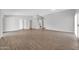 Spacious living room showcasing neutral tones, wood-look flooring, and ample natural light at 5237 W Mountain View Rd, Glendale, AZ 85302