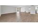 Spacious, light-filled living room boasts wood-look floors and patio access, perfect for relaxing or entertaining at 5237 W Mountain View Rd, Glendale, AZ 85302