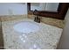 Close up of granite vanity top and wood cabinets at 5902 E Juniper Ave, Scottsdale, AZ 85254