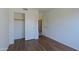 Bedroom featuring a closet with sliding doors and view to hallway at 5902 E Juniper Ave, Scottsdale, AZ 85254