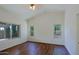 Bright bedroom with three windows offers plenty of natural light and warm wood floors at 5902 E Juniper Ave, Scottsdale, AZ 85254