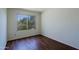 Bedroom includes a sunny window and wood-look floors at 5902 E Juniper Ave, Scottsdale, AZ 85254