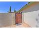 Charming side courtyard with custom gate and mature landscaping offers a welcoming entrance at 5902 E Juniper Ave, Scottsdale, AZ 85254