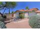 Charming single-story home featuring desert landscaping, a tile roof, and a welcoming front entrance at 5902 E Juniper Ave, Scottsdale, AZ 85254