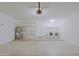 Spacious garage interior with water heater, shelving, and laundry area with washer and dryer at 5902 E Juniper Ave, Scottsdale, AZ 85254