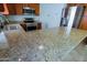 Close-up of a kitchen with stainless steel appliances and granite countertops at 5902 E Juniper Ave, Scottsdale, AZ 85254
