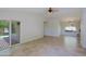 Open living room showcases tiled floors and patio access with shaded outdoor seating at 5902 E Juniper Ave, Scottsdale, AZ 85254