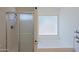 The bathroom features a glass shower and a soaking tub with a frosted window view at 5902 E Juniper Ave, Scottsdale, AZ 85254