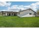 Large grassy backyard with a covered patio area and plenty of space for outdoor activities and entertaining at 615 E Winter Dr, Phoenix, AZ 85020