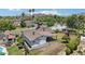 Backyard with a covered patio, grass, and view of the surrounding neighborhood with mountains in the distance at 615 E Winter Dr, Phoenix, AZ 85020