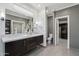 Bathroom featuring double vanity and generous countertop space with toilet and walk-in closet at 615 E Winter Dr, Phoenix, AZ 85020
