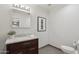 Stylish powder room featuring a marble countertop and wood vanity at 615 E Winter Dr, Phoenix, AZ 85020