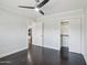 Bright bedroom featuring sleek ceiling fan and a walk-in closet at 615 E Winter Dr, Phoenix, AZ 85020