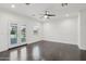 Bright, large bedroom with ceiling fan, and french door access to a patio at 615 E Winter Dr, Phoenix, AZ 85020