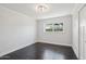 Inviting bedroom features dark hardwood floors and ample natural light at 615 E Winter Dr, Phoenix, AZ 85020